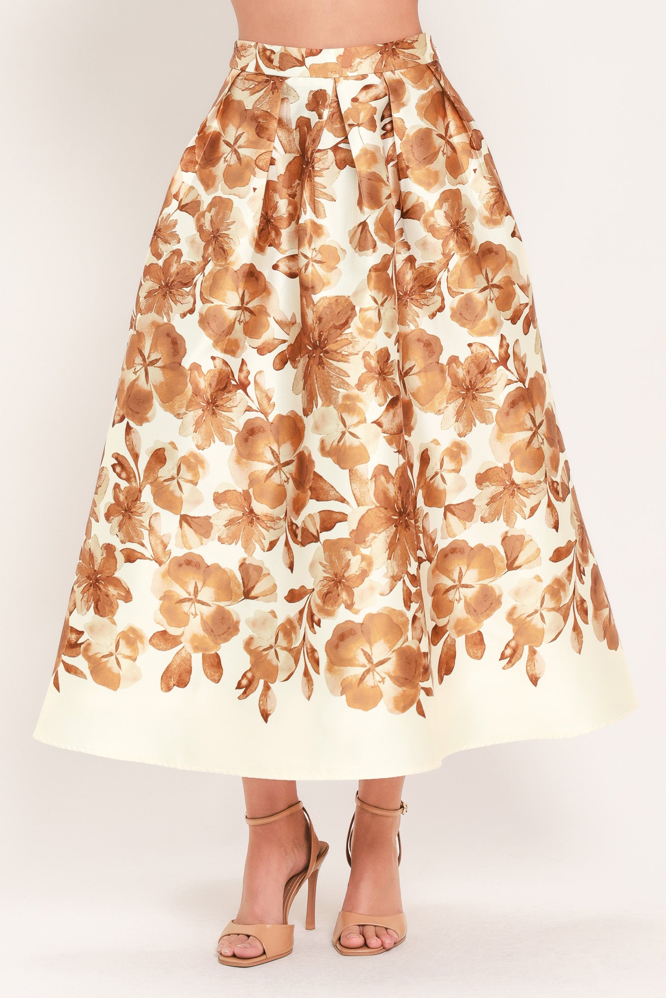 A high-waisted A-line midi skirt with a brown floral print | Flying Tomato