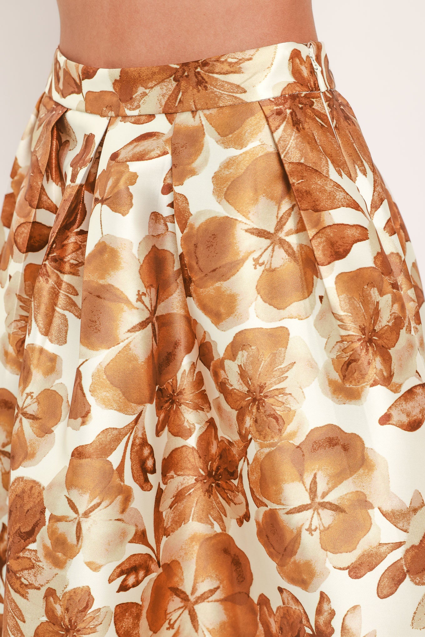 A high-waisted A-line midi skirt with a brown floral print | Flying Tomato