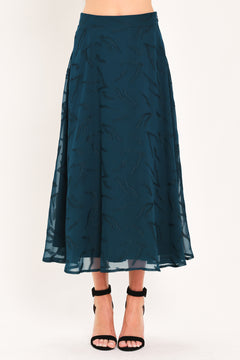 A dark teal blue midi skirt with a subtle tonal leaf pattern | Flying Tomato