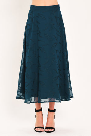 A dark teal blue midi skirt with a subtle tonal leaf pattern | Flying Tomato
