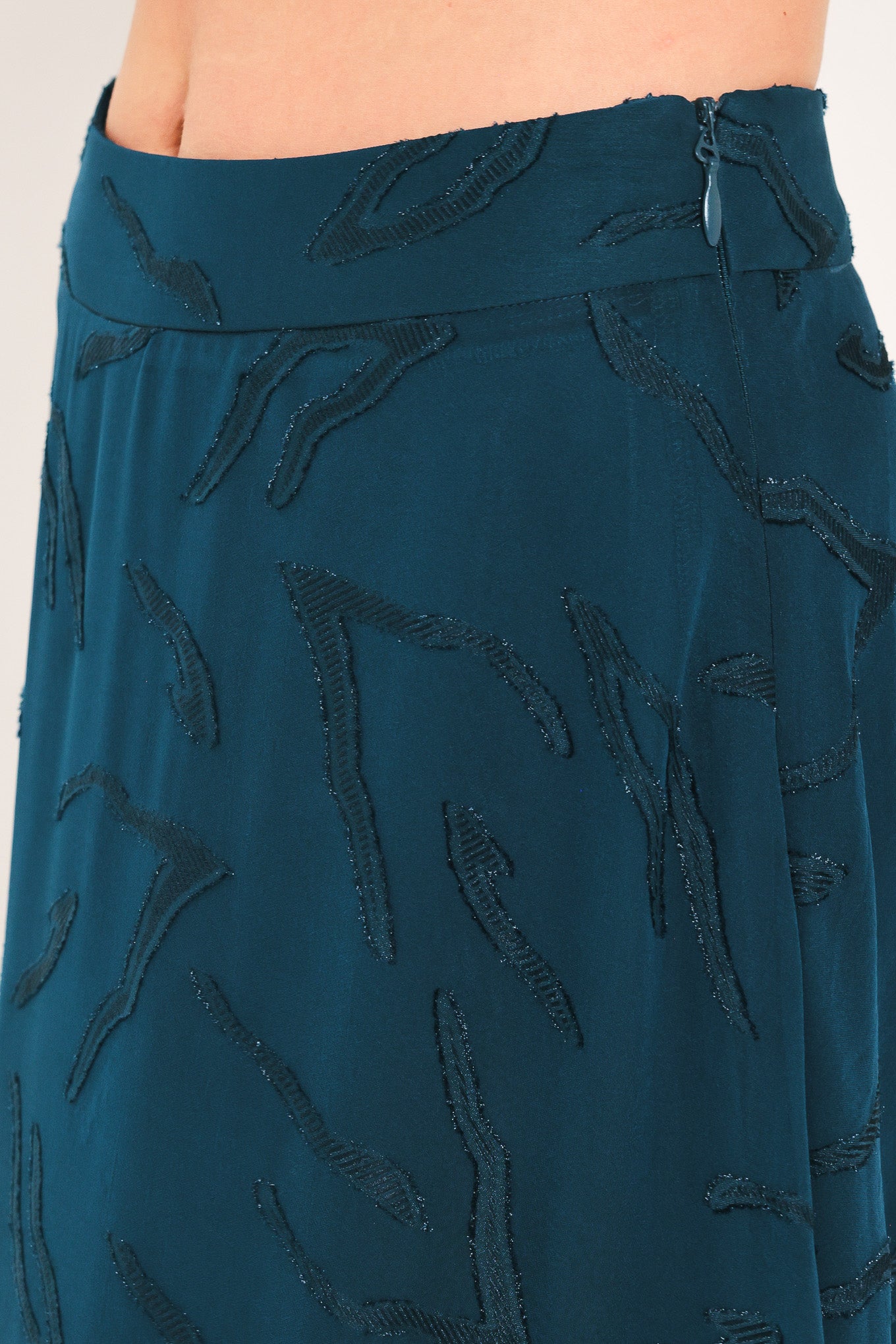 A dark teal blue midi skirt with a subtle tonal leaf pattern | Flying Tomato