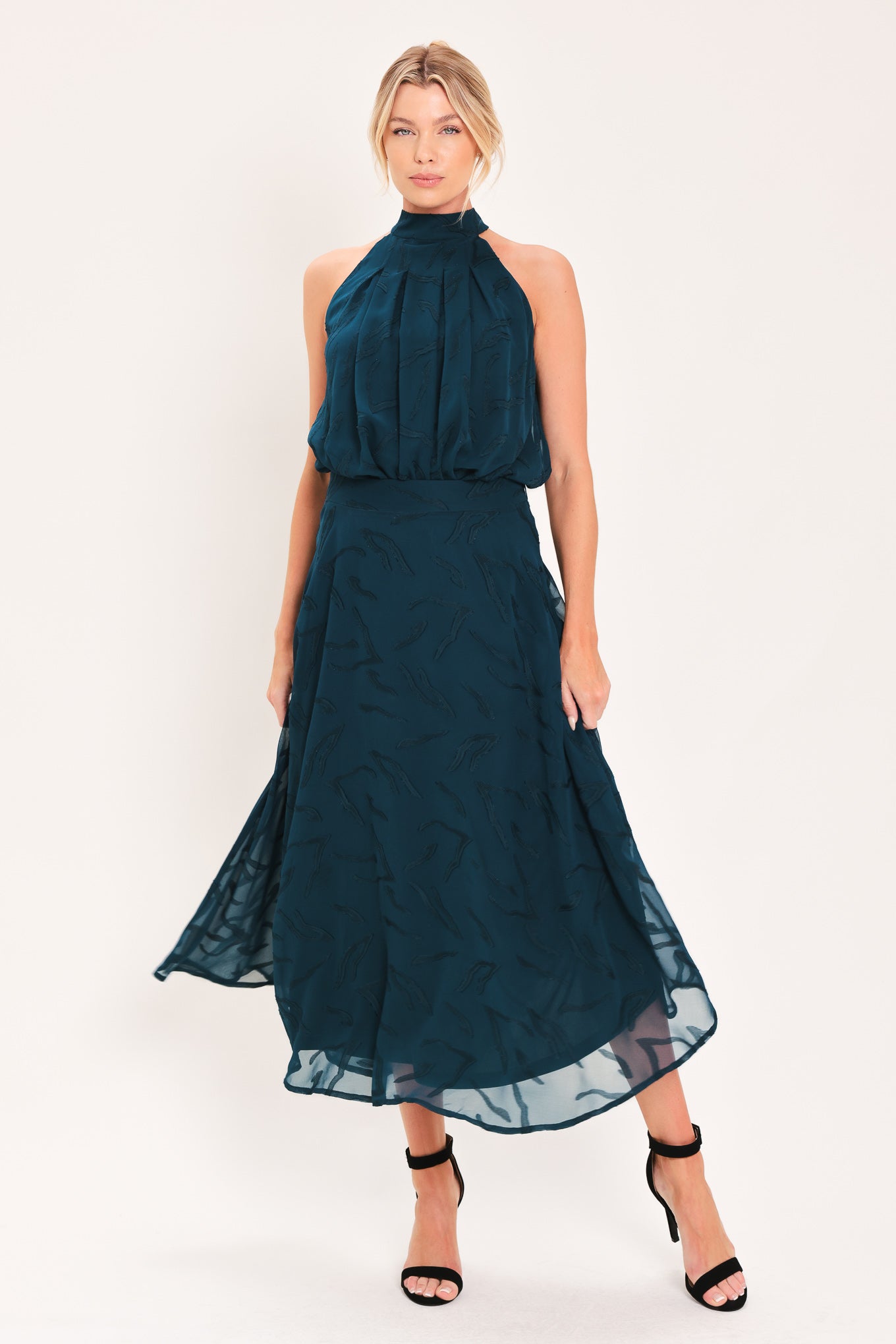 A dark teal blue midi skirt with a subtle tonal leaf pattern | Flying Tomato