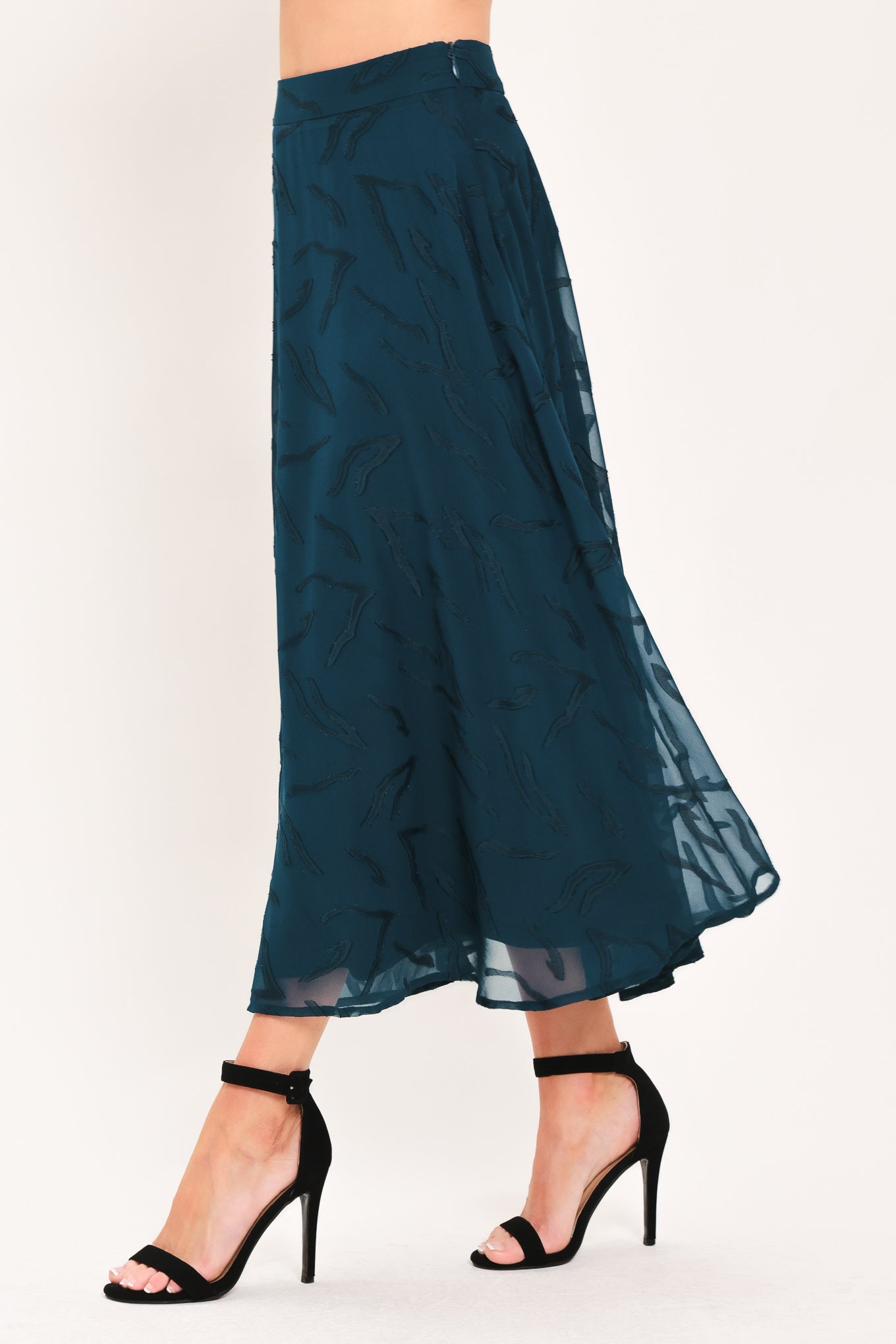 A dark teal blue midi skirt with a subtle tonal leaf pattern | Flying Tomato