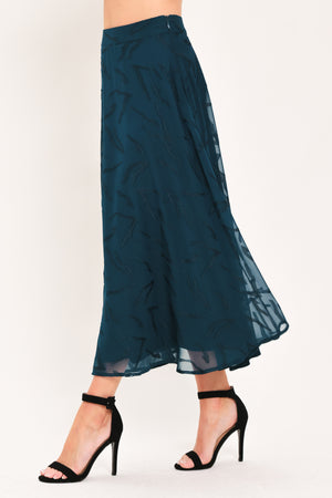 A dark teal blue midi skirt with a subtle tonal leaf pattern | Flying Tomato