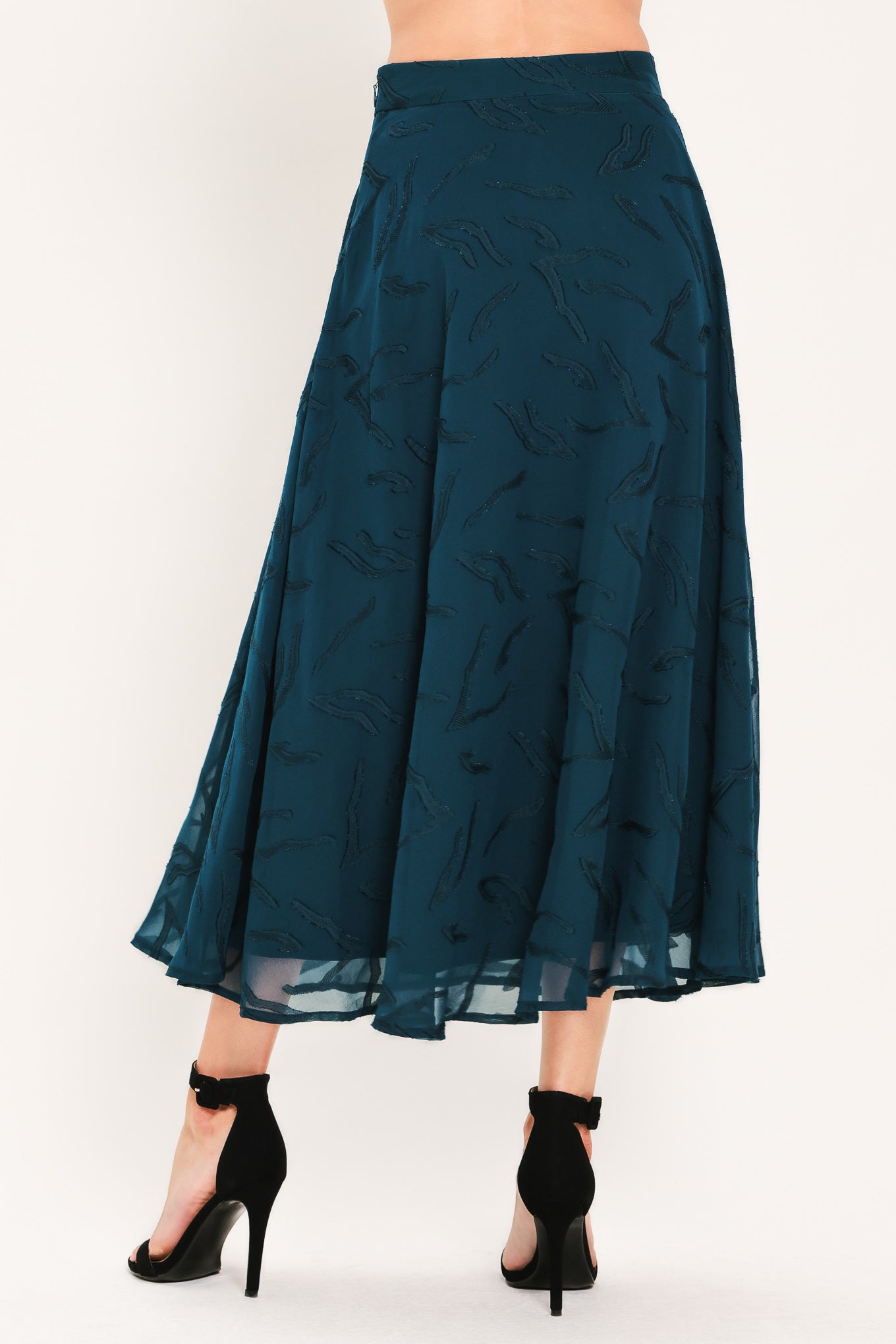 A dark teal blue midi skirt with a subtle tonal leaf pattern | Flying Tomato