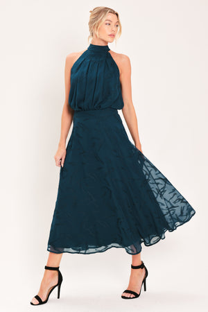 A dark teal blue midi skirt with a subtle tonal leaf pattern | Flying Tomato