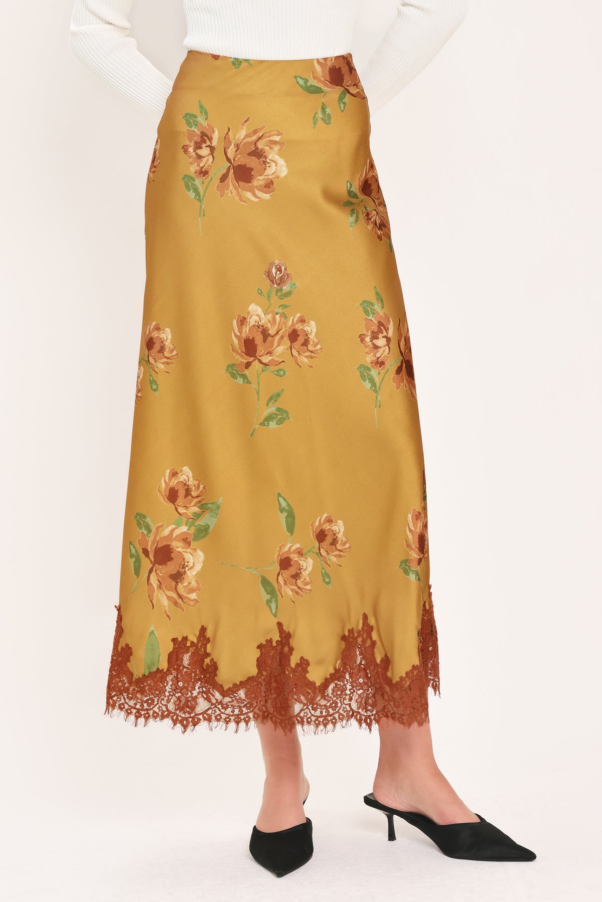 A camel yellow midi skirt with a brown and green floral print and a brown lace hem | Flying Tomato