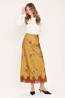 A camel yellow midi skirt with a brown and green floral print and a brown lace hem | Flying Tomato