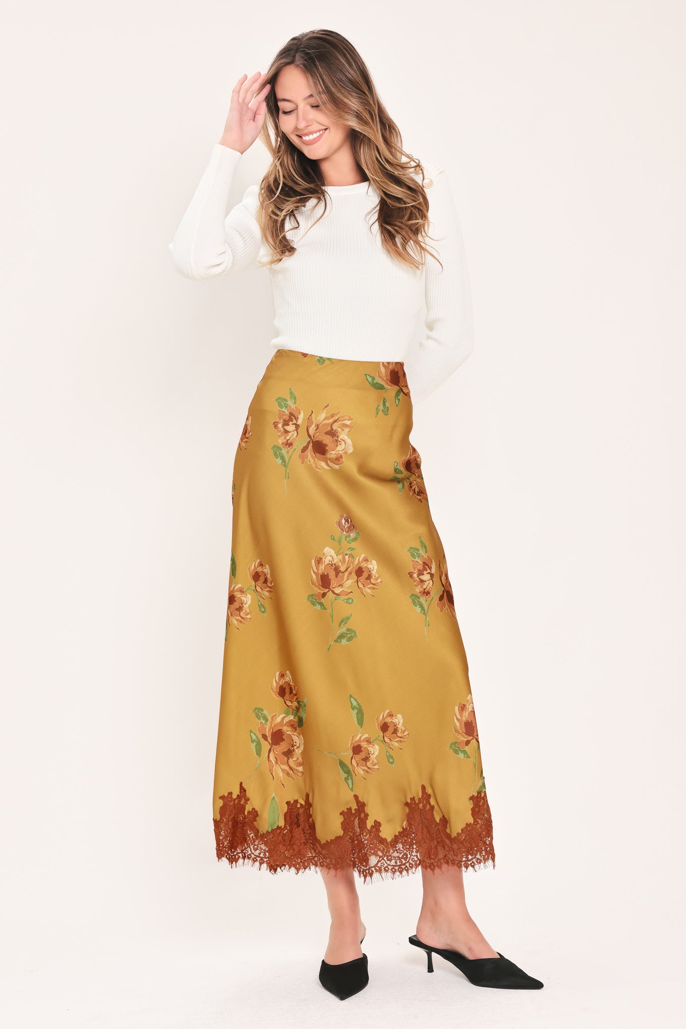 A camel yellow midi skirt with a brown and green floral print and a brown lace hem | Flying Tomato