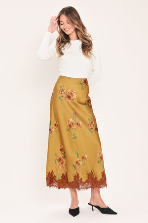 A camel yellow midi skirt with a brown and green floral print and a brown lace hem | Flying Tomato