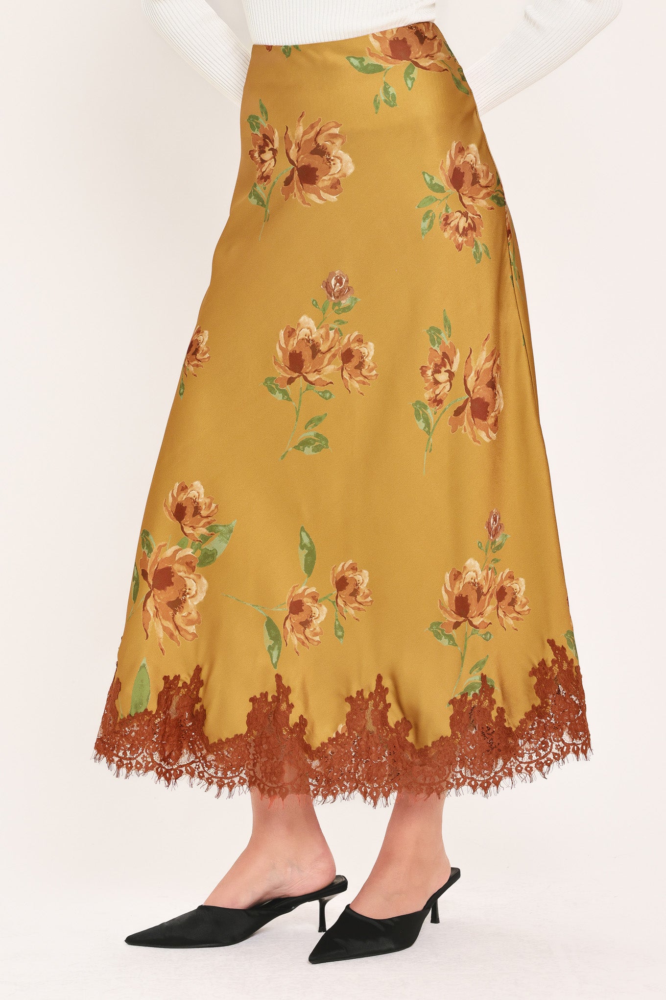 A camel yellow midi skirt with a brown and green floral print and a brown lace hem | Flying Tomato