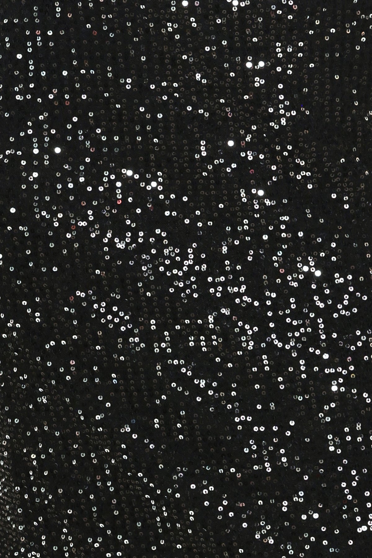A woman modeling a black sequined midi skirt with a lace hem | Flying Tomato
