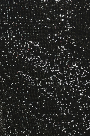 A woman modeling a black sequined midi skirt with a lace hem | Flying Tomato