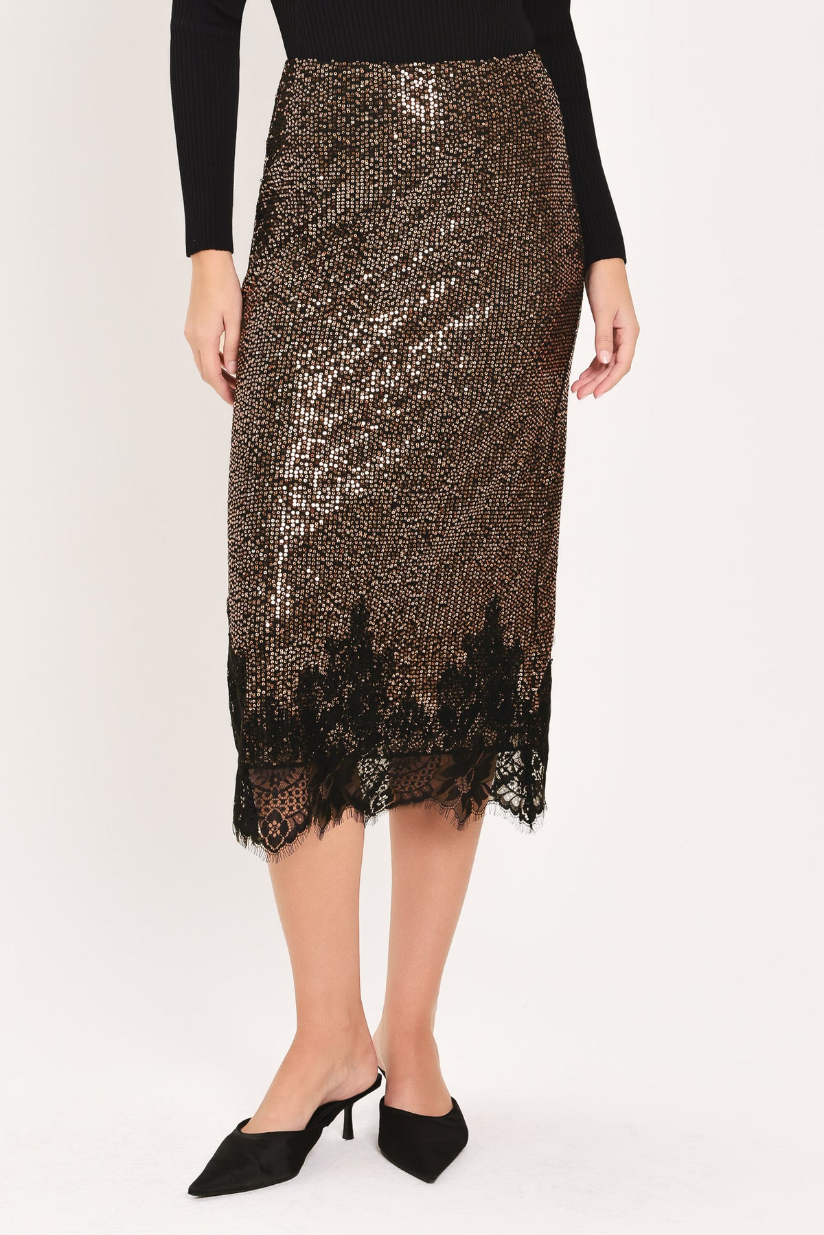 A woman modeling a bronze sequined midi skirt with a black lace hem | Flying Tomato