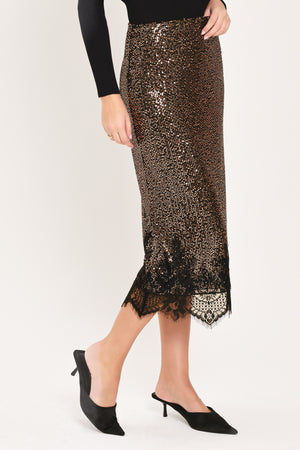 A woman modeling a bronze sequined midi skirt with a black lace hem | Flying Tomato