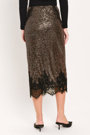 A woman modeling a bronze sequined midi skirt with a black lace hem | Flying Tomato
