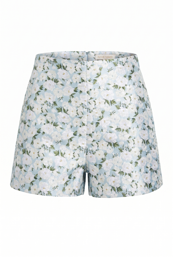 Blue jacquard shorts with white flowers printed on over a white background | Flying Tomato