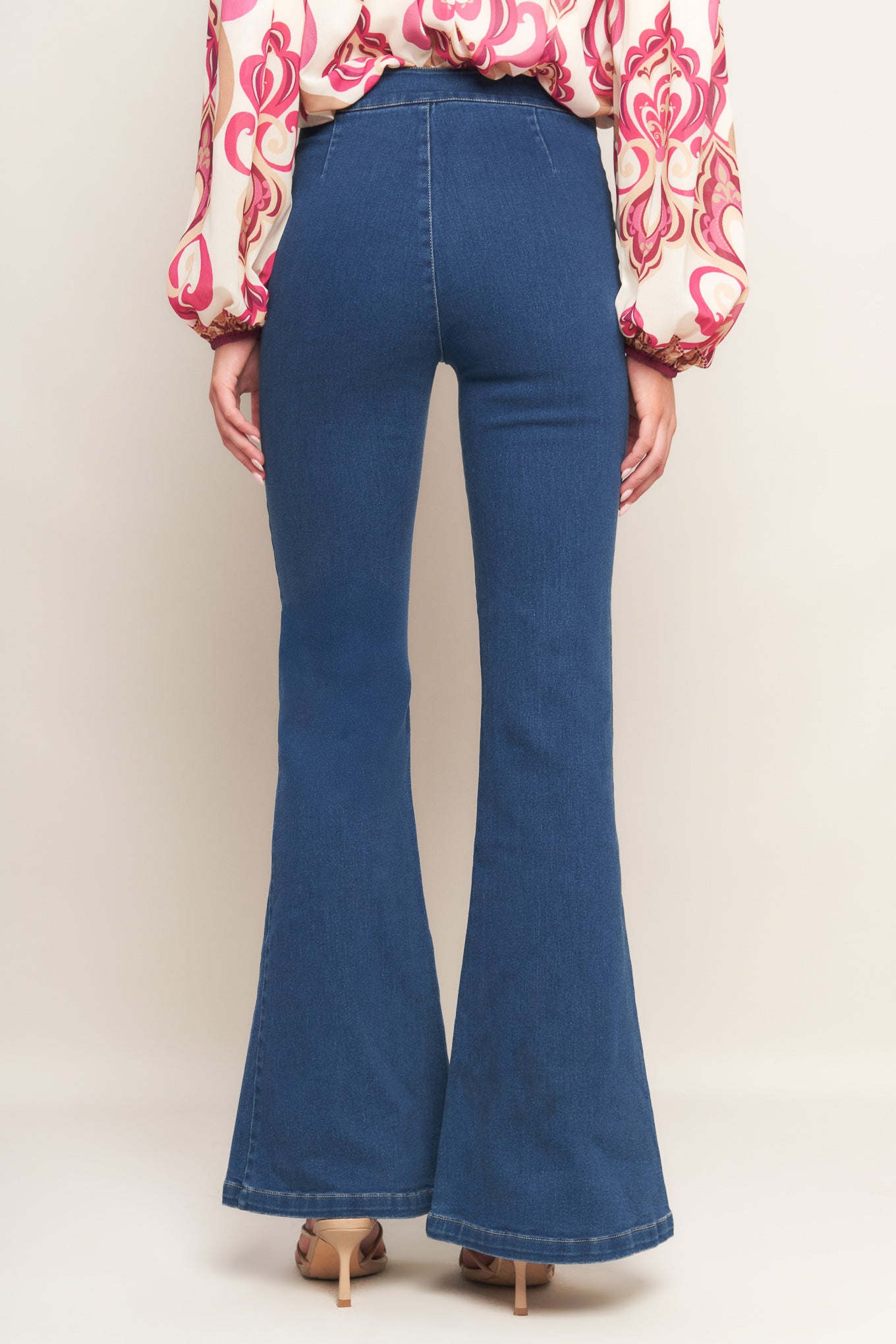 A washed denim with flare bottom and side zipper closure