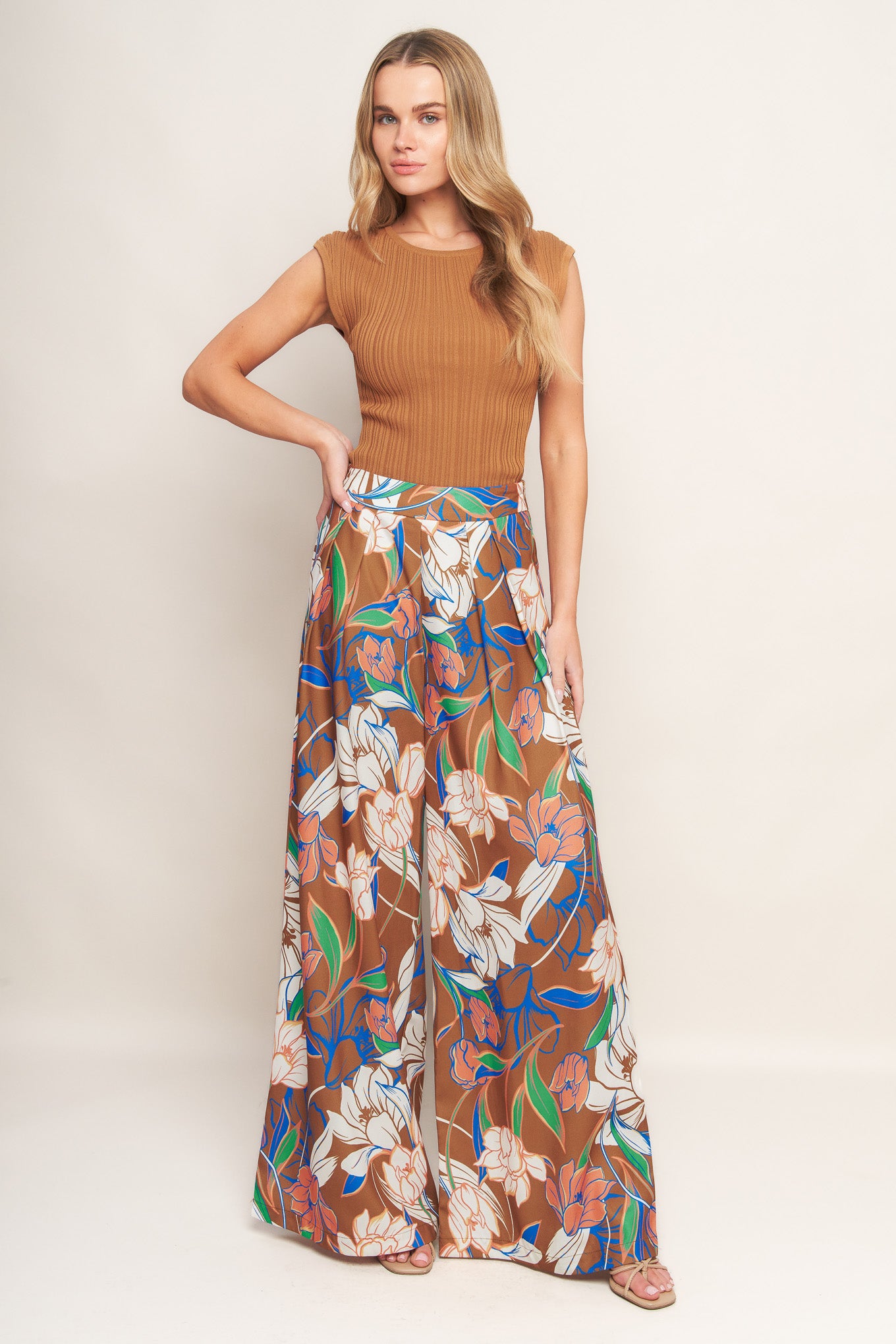 A printed woven pant with a side zipper and wide legs.