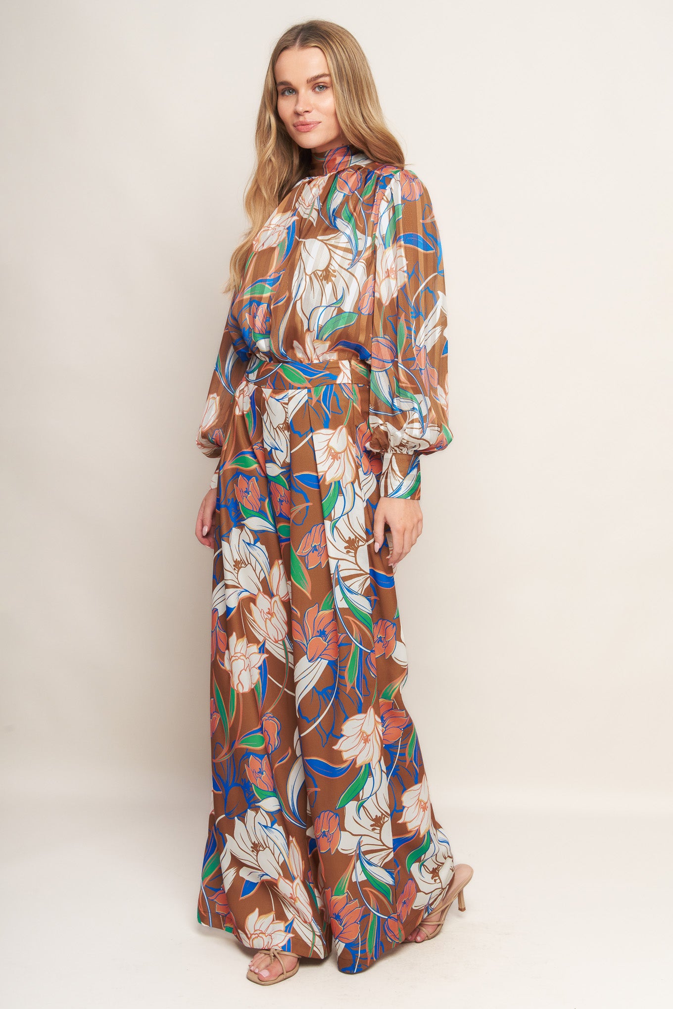 A printed woven pant with a side zipper and wide legs.