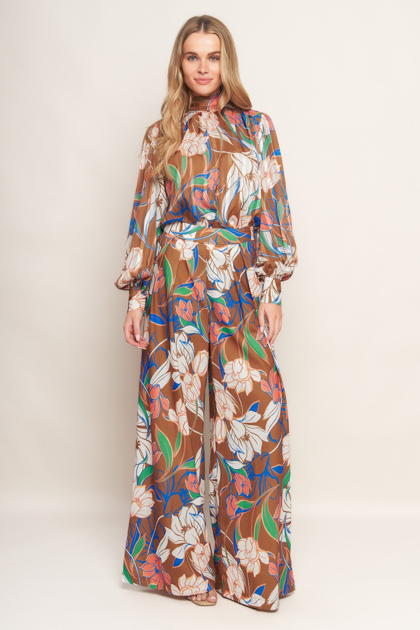 A printed woven pant with a side zipper and wide legs.