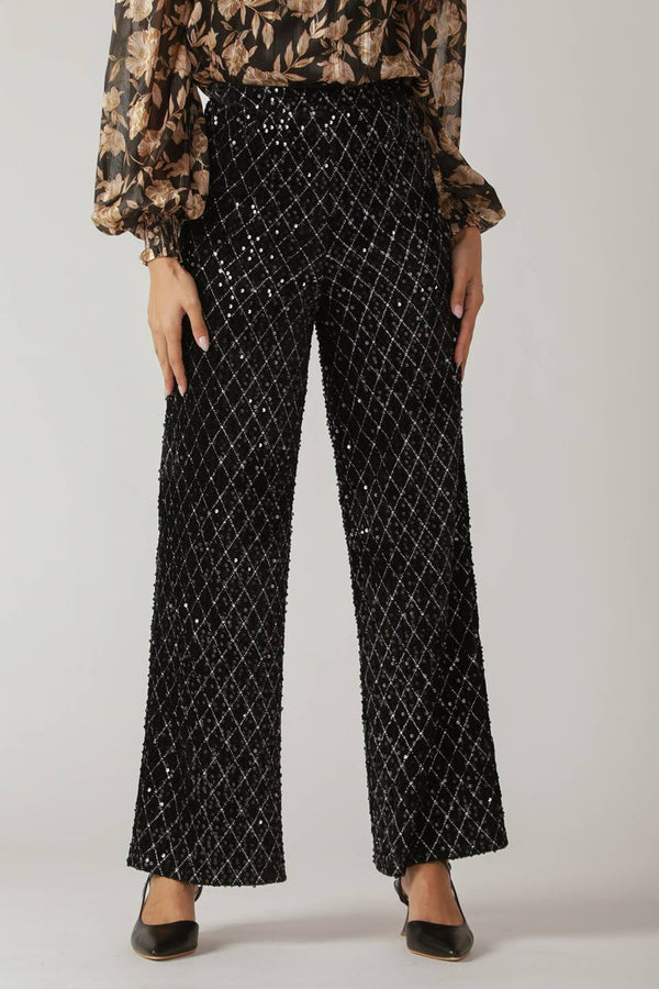 Woman wearing black sequin pants | FREEMARKET