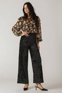 Woman wearing black sequin pants | FREEMARKET