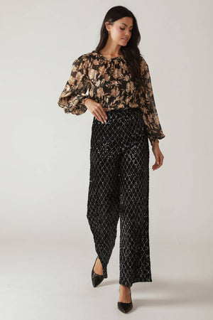 Woman wearing black sequin pants | FREEMARKET