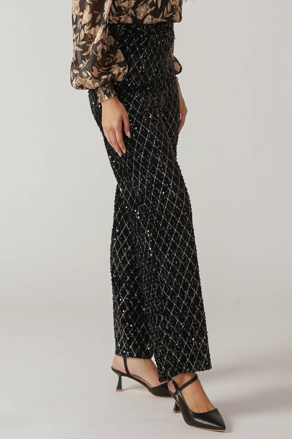 Woman wearing black sequin pants | FREEMARKET
