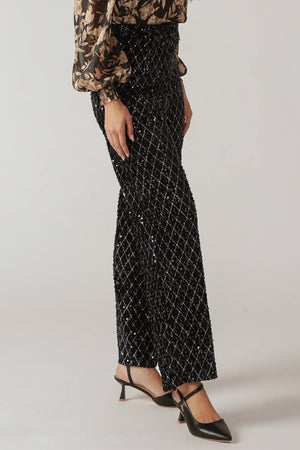 Woman wearing black sequin pants | FREEMARKET