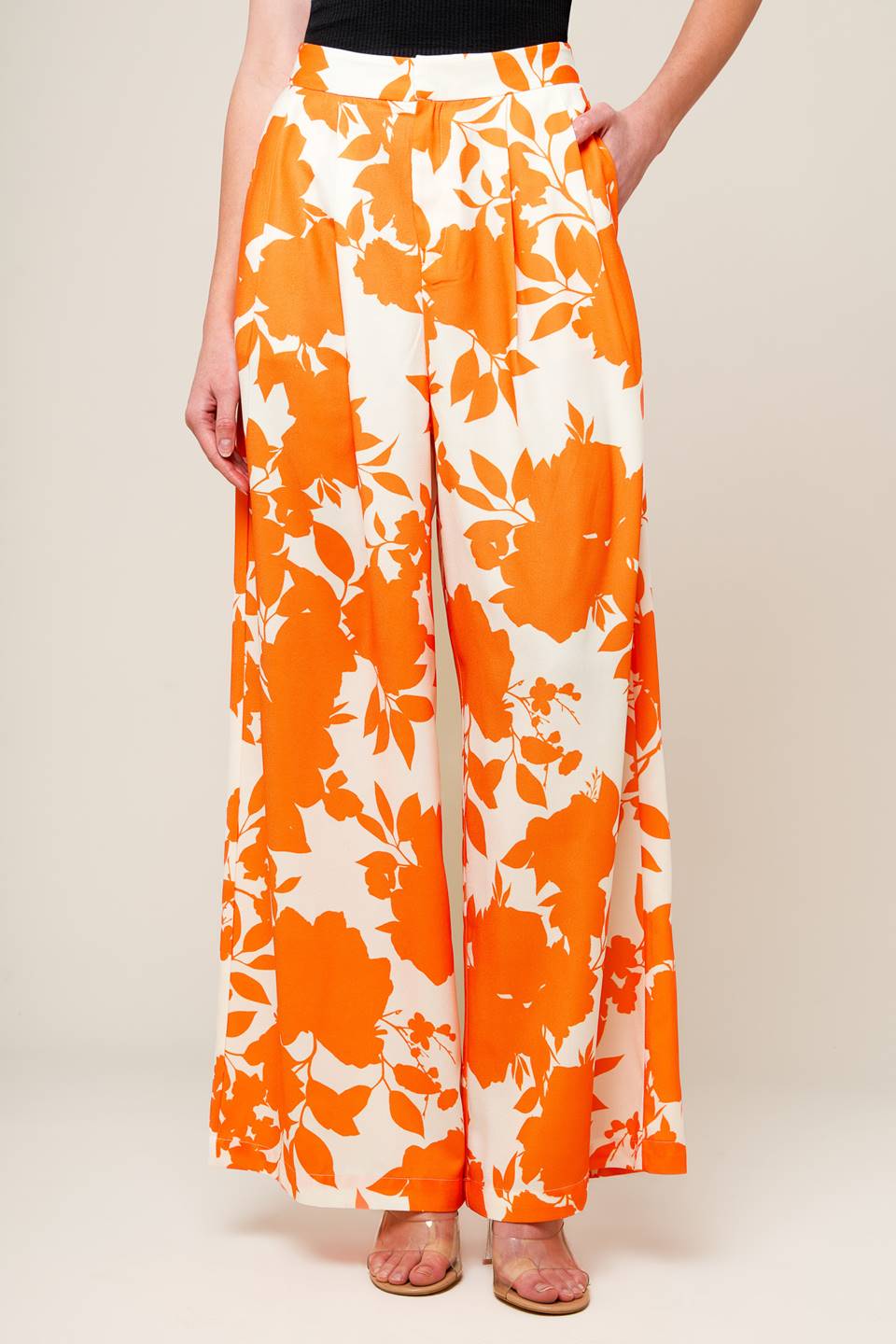 expertly crafted white and orange printed woven pants, featuring a wide-leg design, convenient front closure, and functional side pockets.