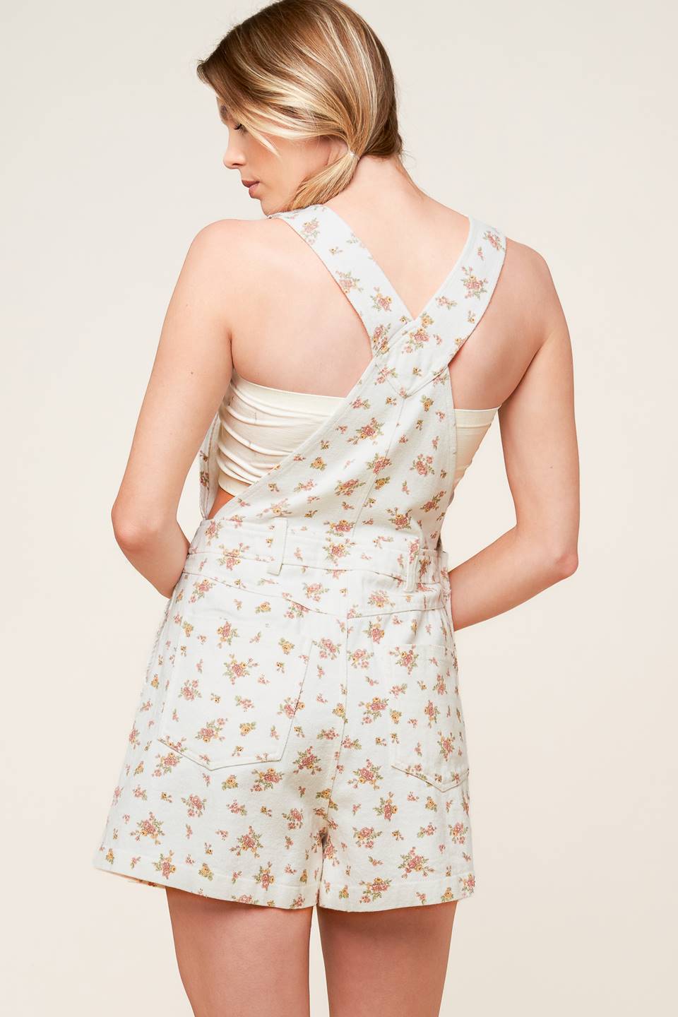 A floral printed woven overall romper.