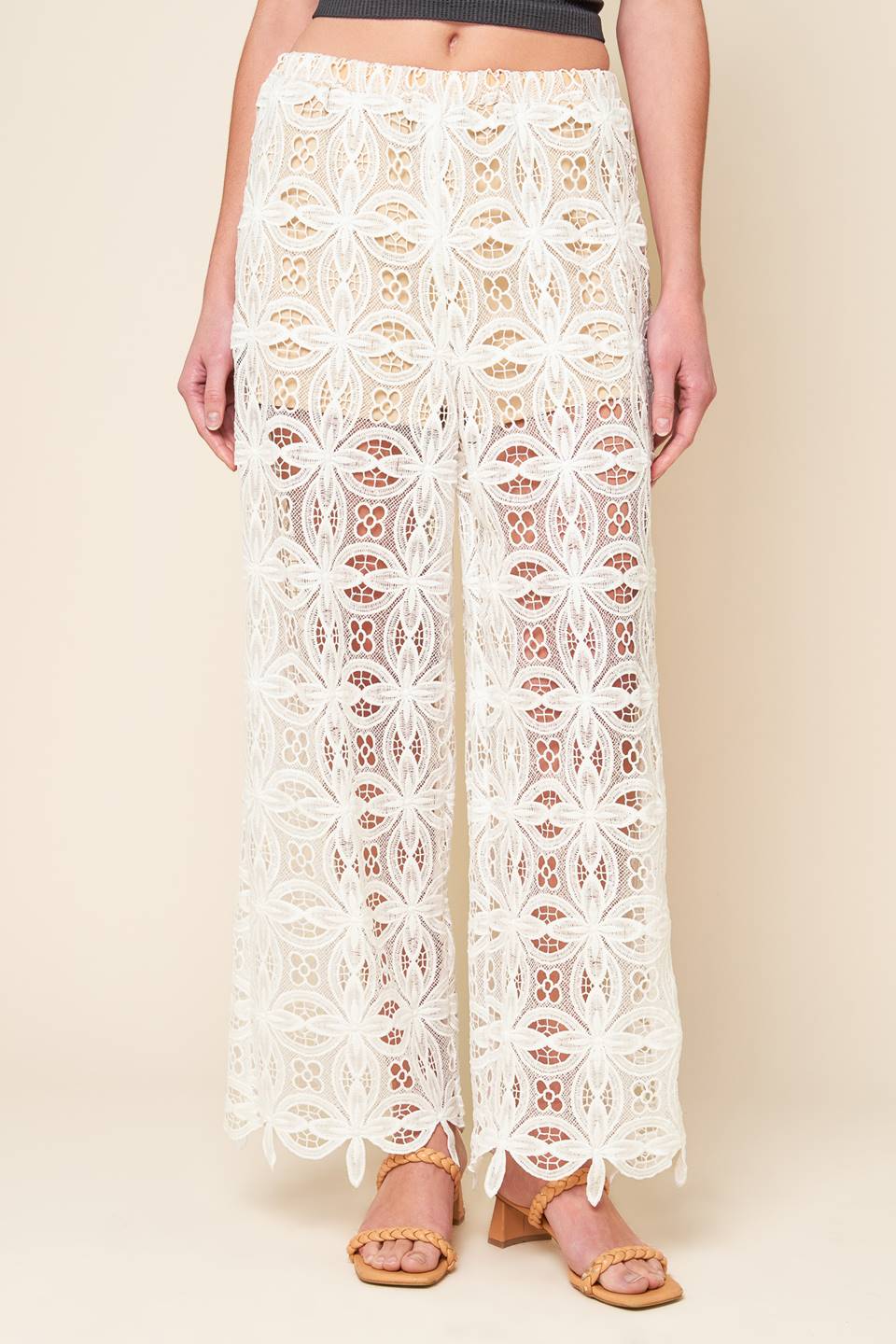 A woven lace pant with elasticized waist and wide leg