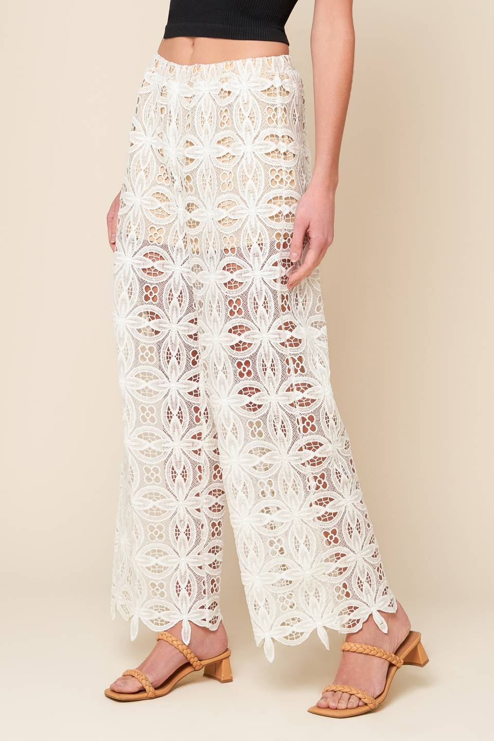 A woven lace pant with elasticized waist and wide leg