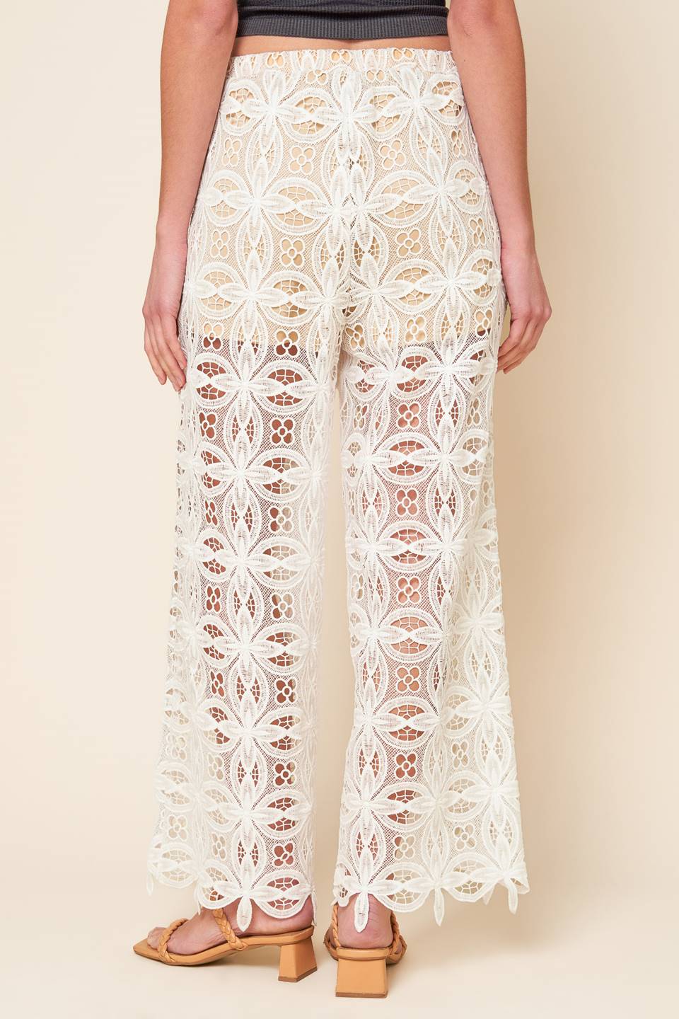 A woven lace pant with elasticized waist and wide leg