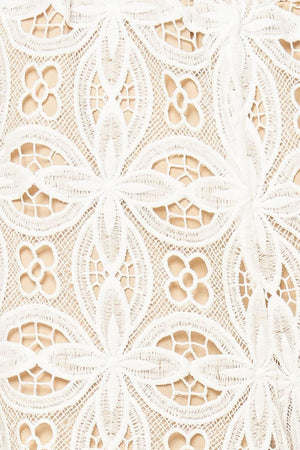A woven lace pant with elasticized waist and wide leg