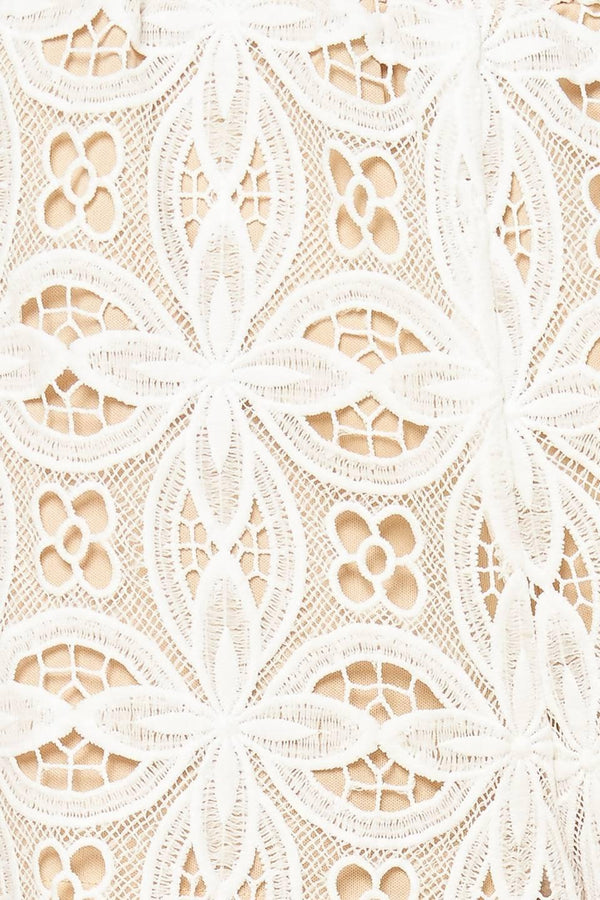 A woven lace pant with elasticized waist and wide leg