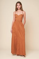 A stylish jumpsuit with a woven design and a cami top, complete with straps and a self belt. Also includes a smocked back bodice and wide leg for added comfort.