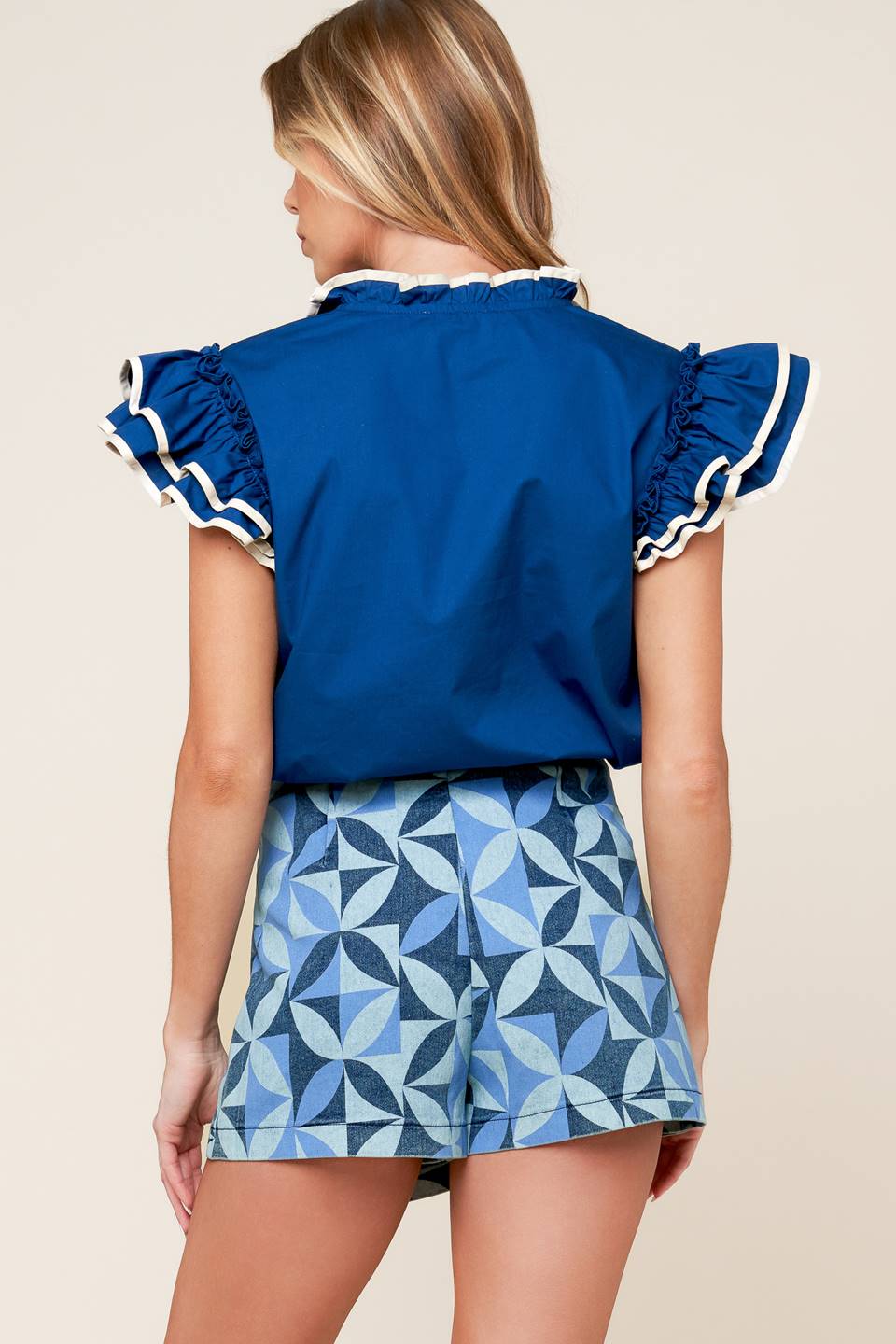 A printed denim skort with side zipper closure