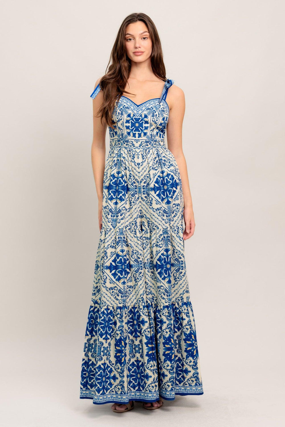 
A printed woven jumpsuit featuring sweetheart neckline, shoulder tie, tiered pant and smocked back bodice

Details:

Self : 100% Cotton

Size &amp; Fit

- Model is 5`8" And Wearing Size Small
- Measurements Taken From Size Small
- Approx. Length: 58"
