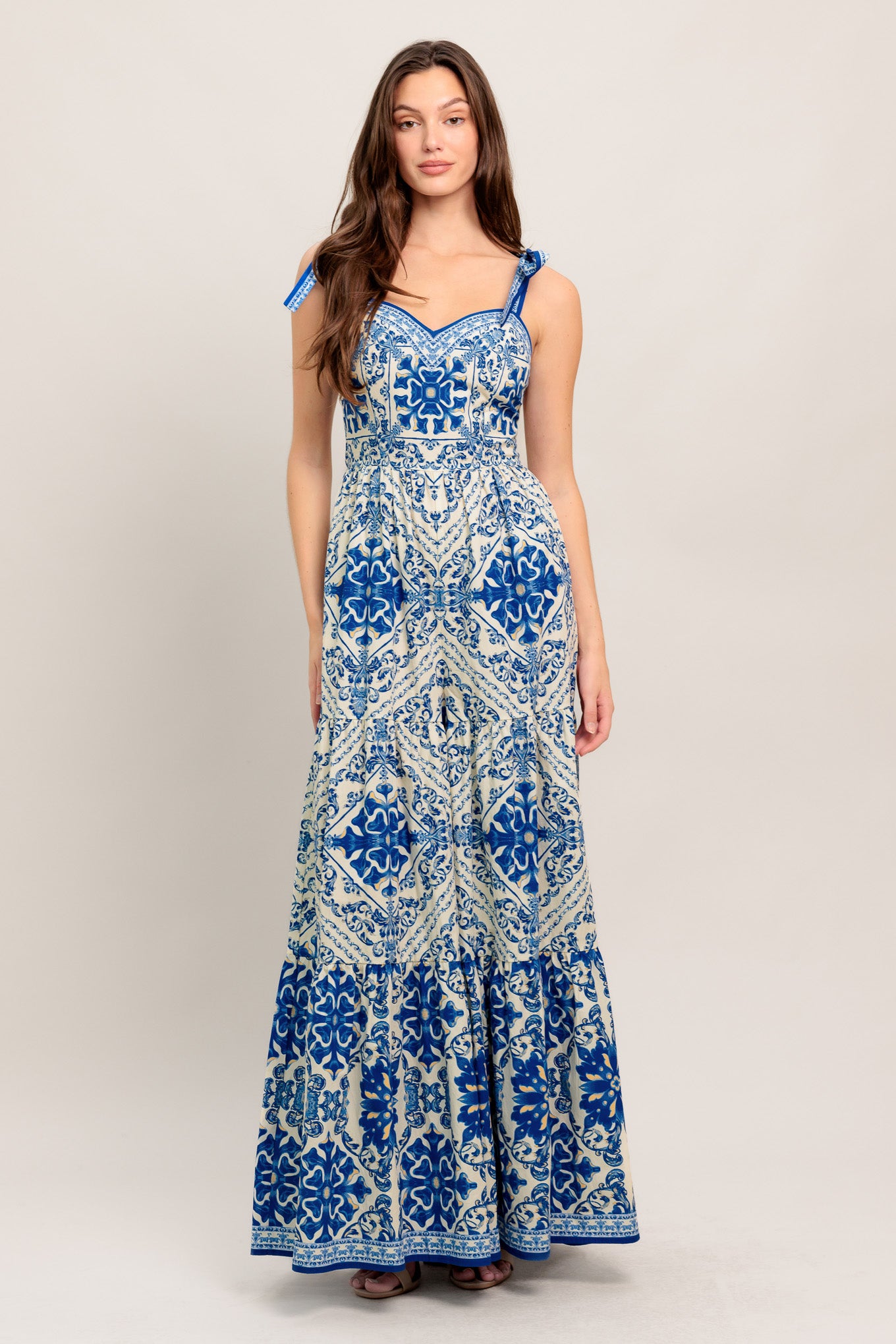 
A printed woven jumpsuit featuring sweetheart neckline, shoulder tie, tiered pant and smocked back bodice

Details:

Self : 100% Cotton

Size &amp; Fit

- Model is 5`8" And Wearing Size Small
- Measurements Taken From Size Small
- Approx. Length: 58"