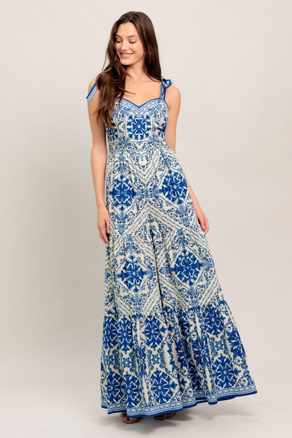 
A printed woven jumpsuit featuring sweetheart neckline, shoulder tie, tiered pant and smocked back bodice

Details:

Self : 100% Cotton

Size &amp; Fit

- Model is 5`8" And Wearing Size Small
- Measurements Taken From Size Small
- Approx. Length: 58"