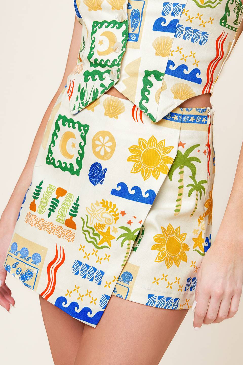 A printed woven skort with side zipper closure.