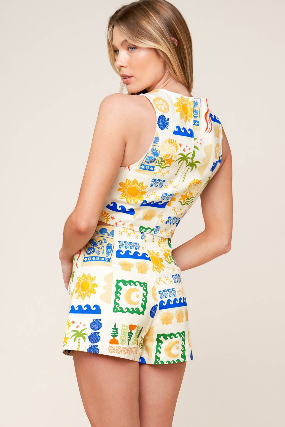 A printed woven skort with side zipper closure.