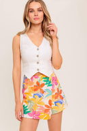A printed woven skort with side zipper closure.