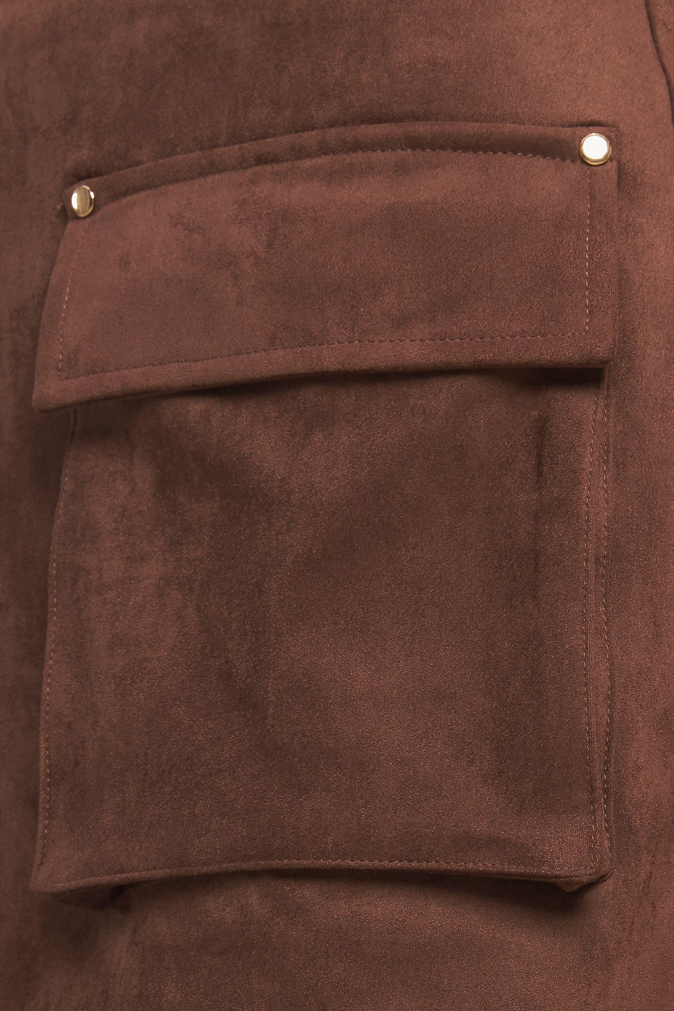 A faux suede skort featuring front pockets and back zipper closure