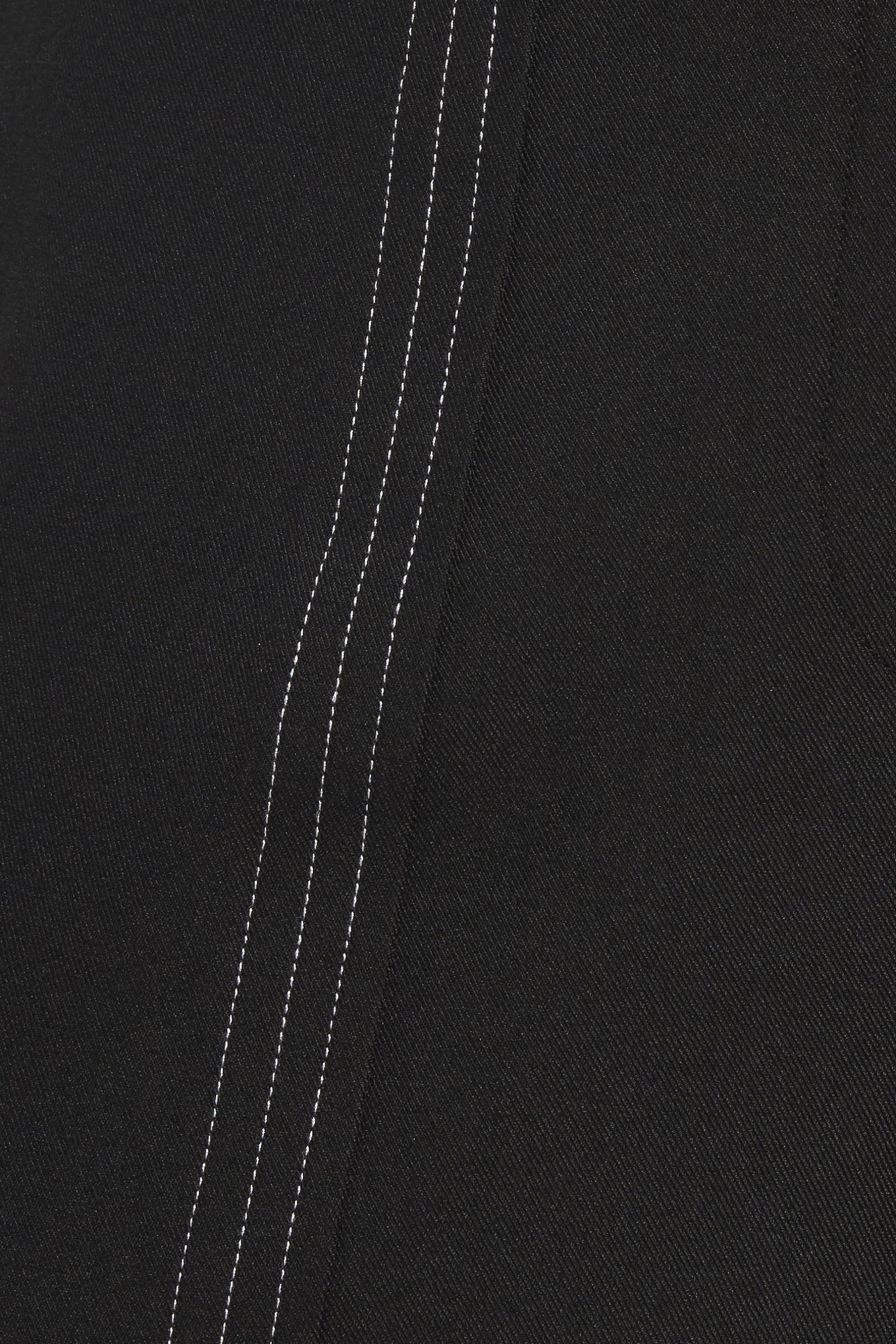 A solid woven wide leg pant with side zipper closure