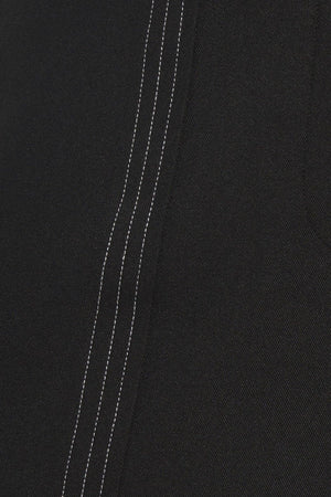 A solid woven wide leg pant with side zipper closure