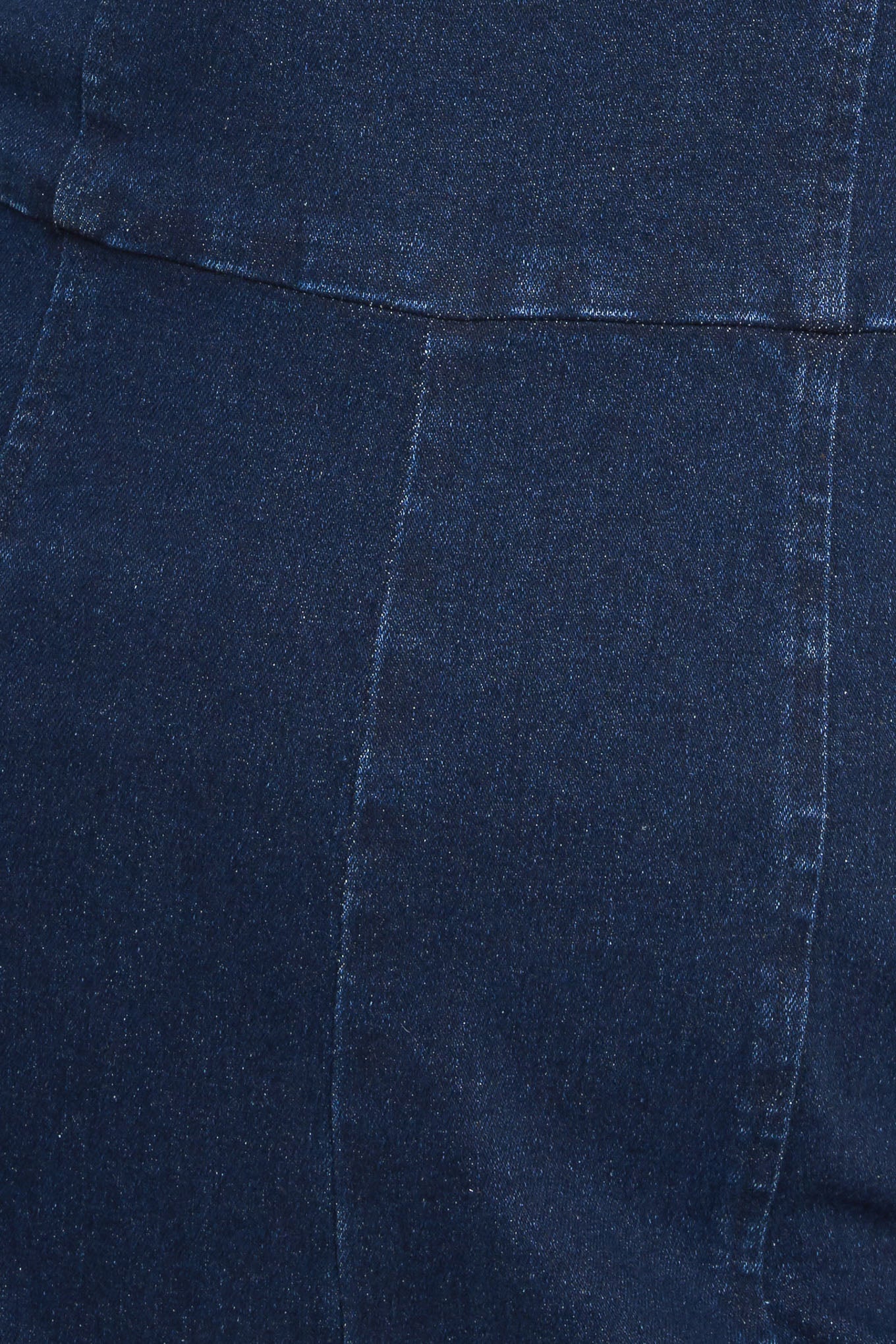 A washed denim jumpsuit featuring bustier top with straps, side leg and back zipper closure