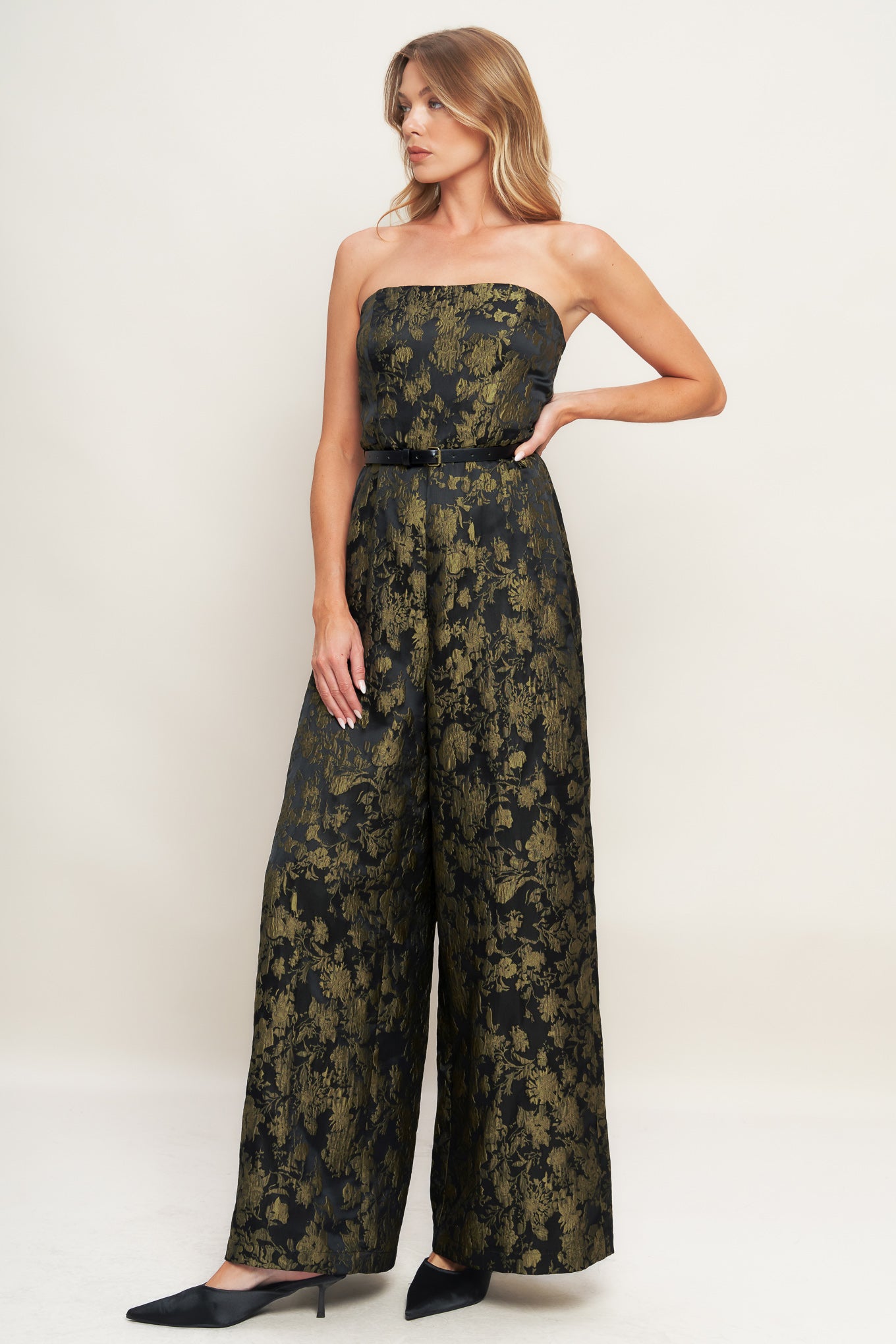 A jacquard woven jumpsuit featuring strapless neckline, contrasting belt, wide leg and back zipper closure
